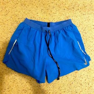 Blue Nike running shorts